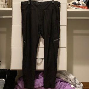 Black leggings with gray stripe on side and pockets